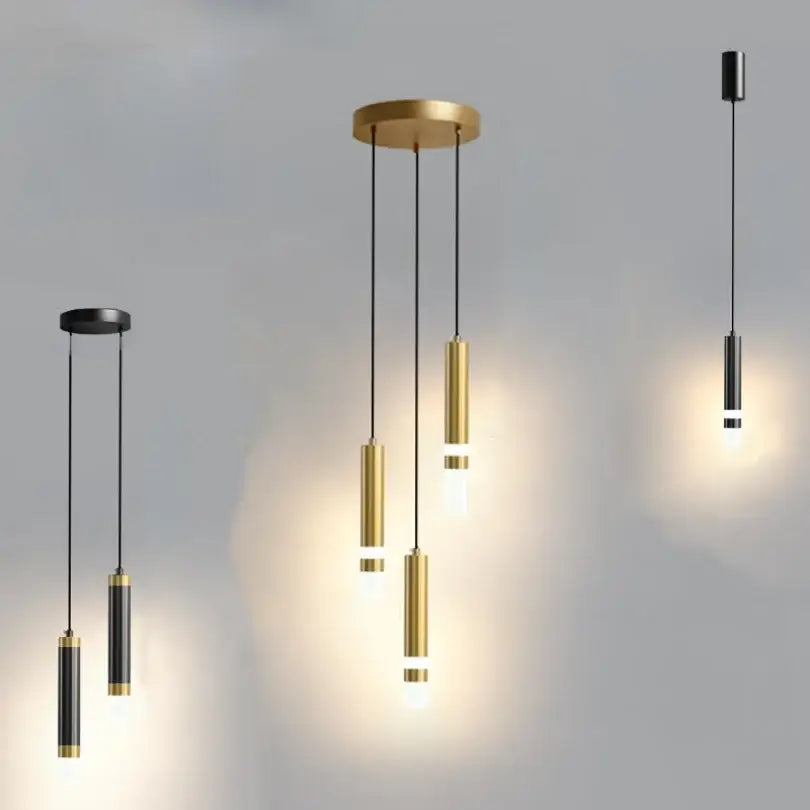 Modern gold double head led pendant lights with sleek gold and black brushed metal cylindrical shades for bedroom use
