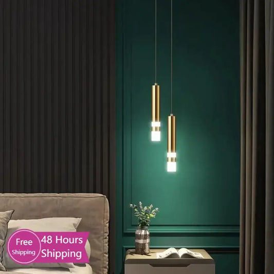 Modern gold double head led pendant lights with illuminated white bands hang from ceiling for bedroom lighting
