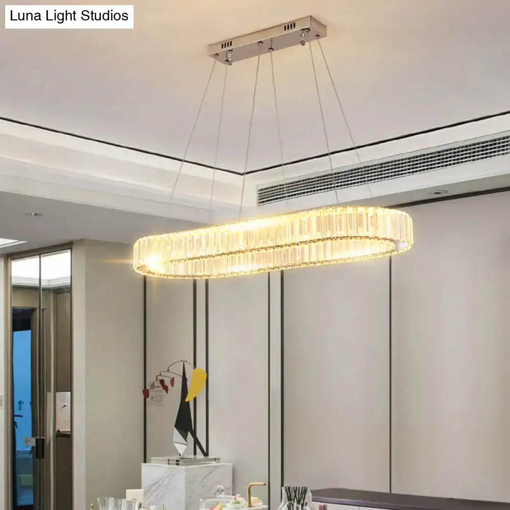 Decorbites™ sleek led suspension lamp with oval chrome frame and optical k9 crystal rods emitting warm golden light