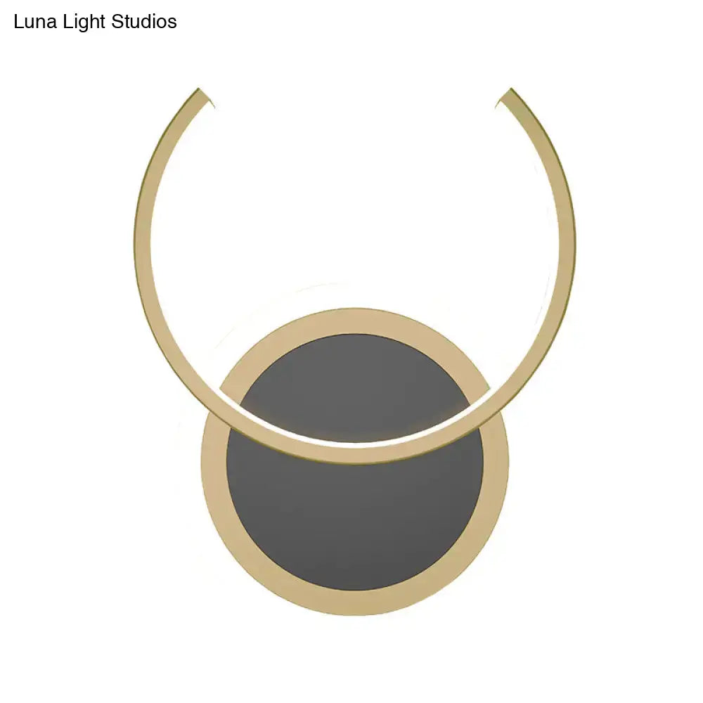 Modern gold dual ring led wall sconce featuring a minimalist gold-toned pendant light with a circular base and arched ring