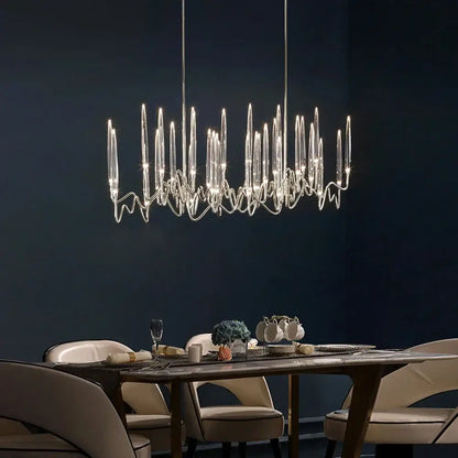 Modern gold elegant candle shape ceiling chandelier with slender transparent glass arms and sleek metallic frame decorbites elegant candle