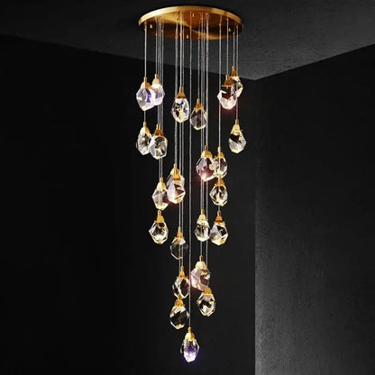 A modern gold elegant crystal chandelier with faceted clear crystals and circular ceiling mount for living room decorbites elegant