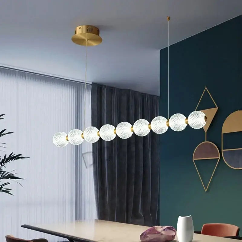 Modern gold elegant pearl necklace chandelier featuring textured frosted glass spheres and metallic joints for living room decorbites elegant pearl decor
