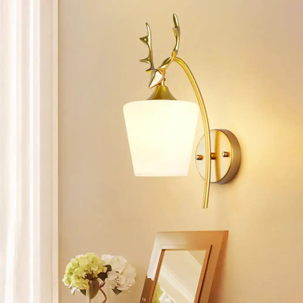 Modern gold elk led incandescent wall sconce featuring a gold-toned deer antler design with frosted white glass shade