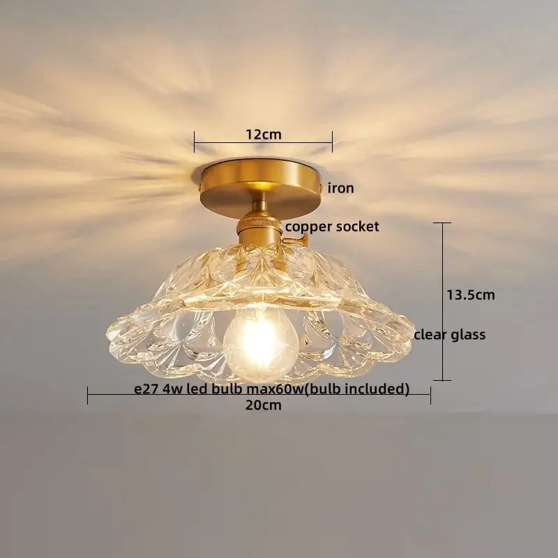 A delicate clear glass led ceiling lamp with brass iron base and copper socket for modern living room lighting
