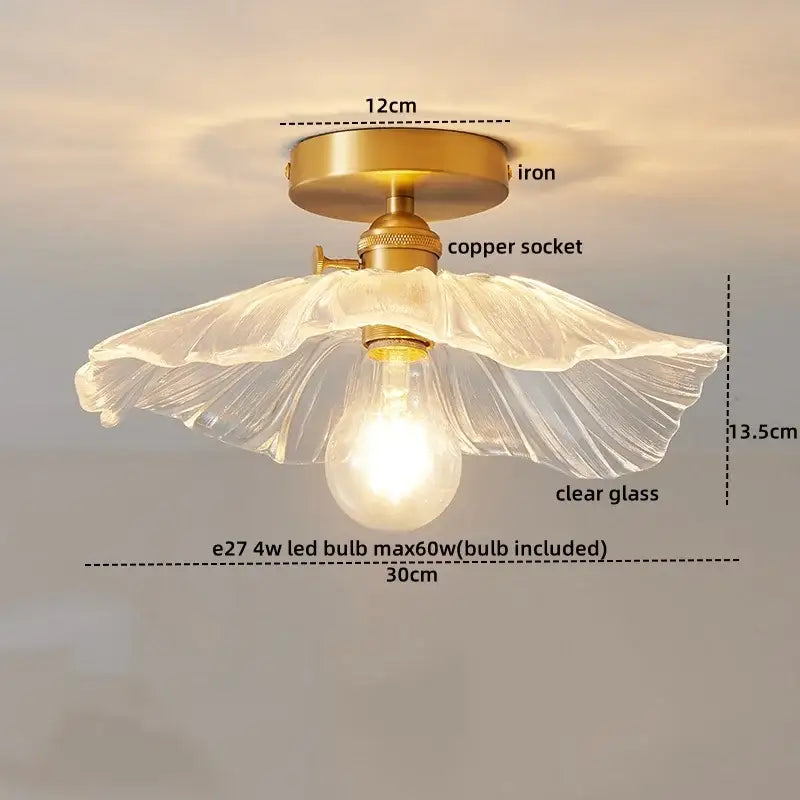 Modern gold etched glass led ceiling lamp with a translucent fluted glass shade on antique brass base for living room use
