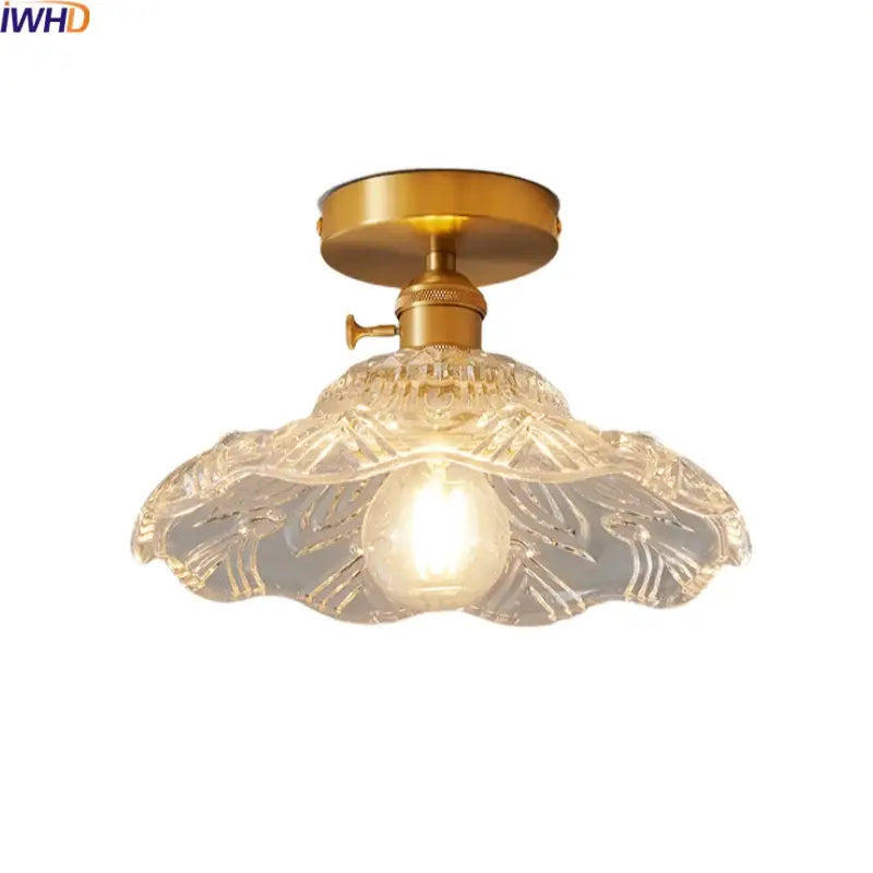 Modern gold-toned led ceiling lamp with intricately etched clear glass shade featuring leaf-like patterns for living room