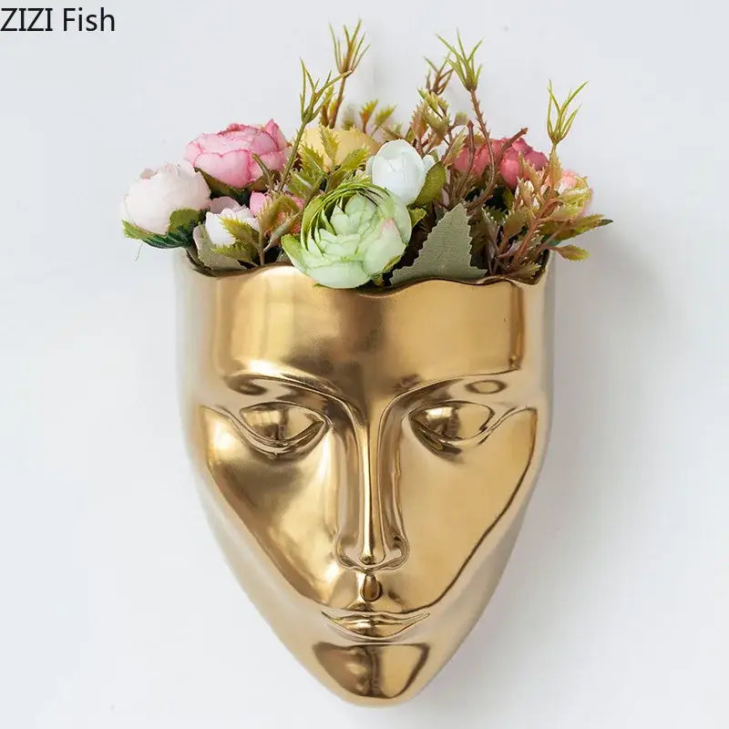 Modern gold decorbites ceramic wall-mounted vase shaped like a face with artificial pink white and green flowers for decorbites ceramic wall-mounted use