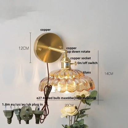 Brass-finished copper wall lamp with adjustable arm and faceted amber clear glass shade for modern wall light use