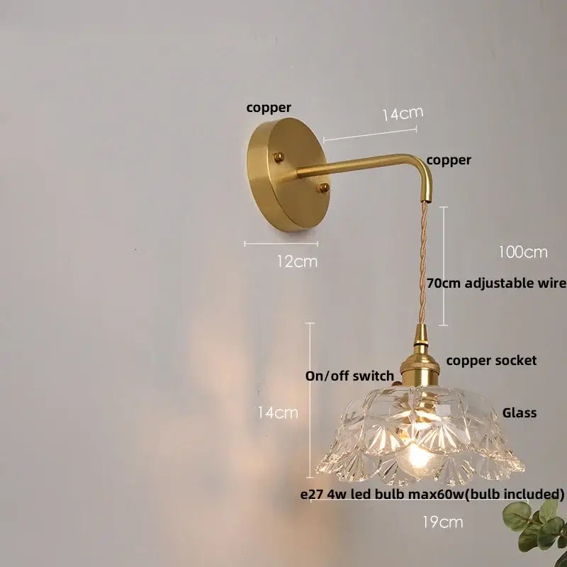 Antique brass-finished copper wall light with faceted clear glass decorbites clear glass shade and adjustable wire