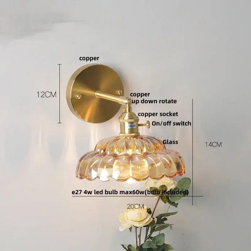 Modern gold faceted clear glass wall light with brass copper finish and amber-tinted scalloped glass for bedroom decorbites