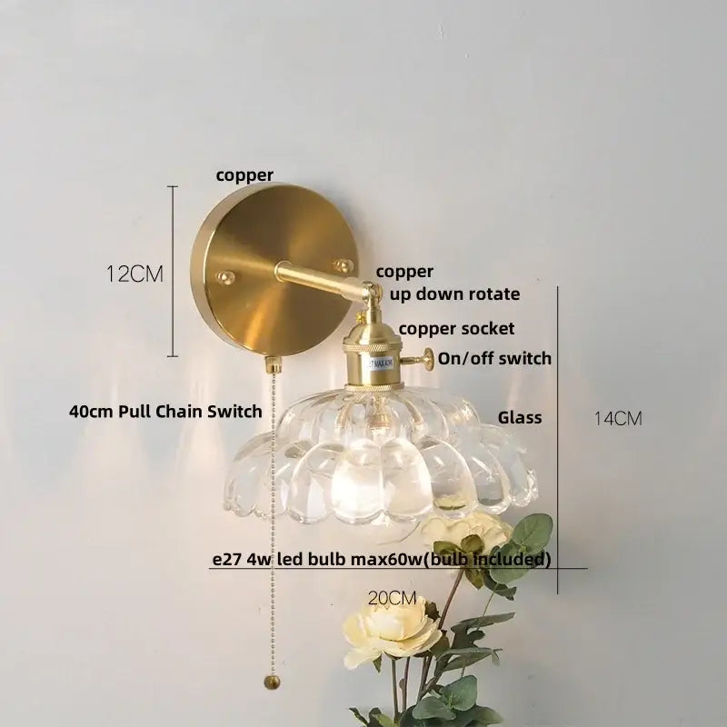 A vintage-style wall light with a brass copper finish and faceted clear glass shade by decorbites clear glass