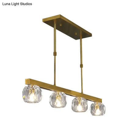 Modern gold faceted crystal island pendant light with brass finish and four faceted crystal sphere shades for kitchen dining room