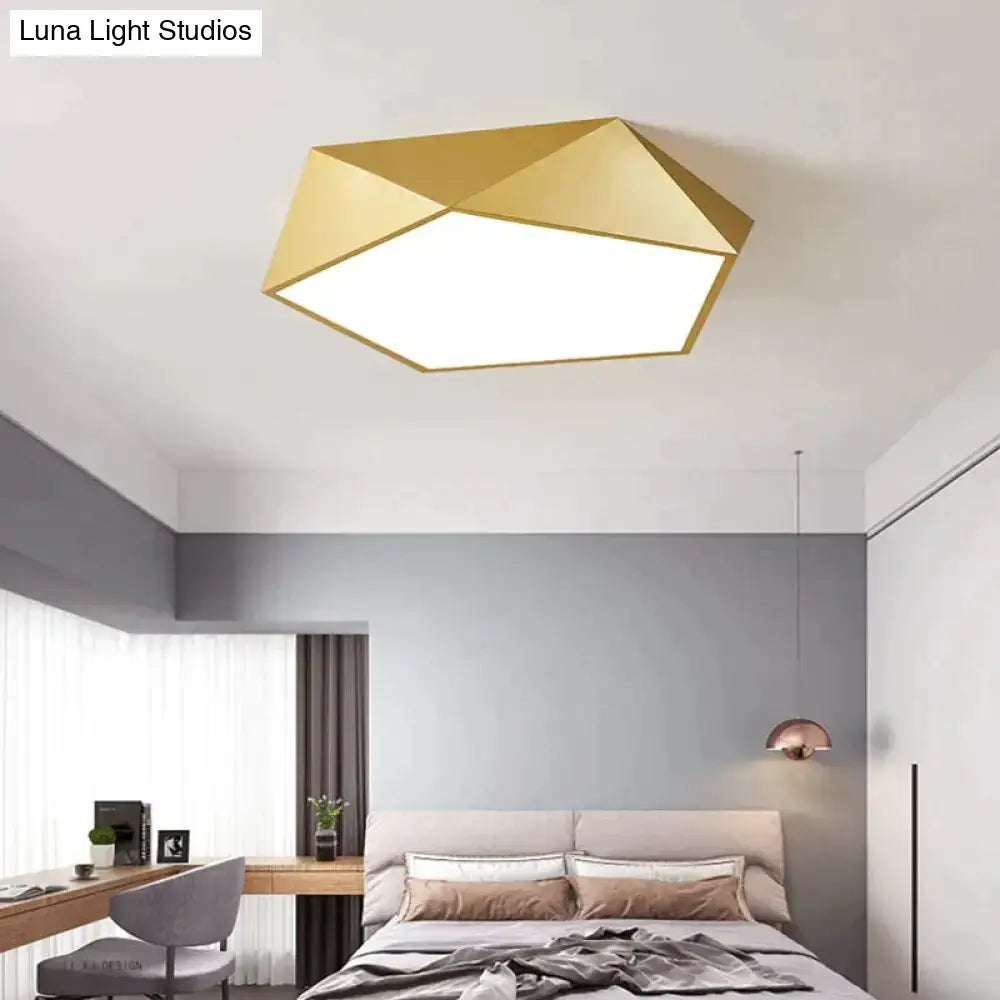 Gold geometric ceiling light with modern faceted design and sleek metallic finish for living room and bedroom lighting