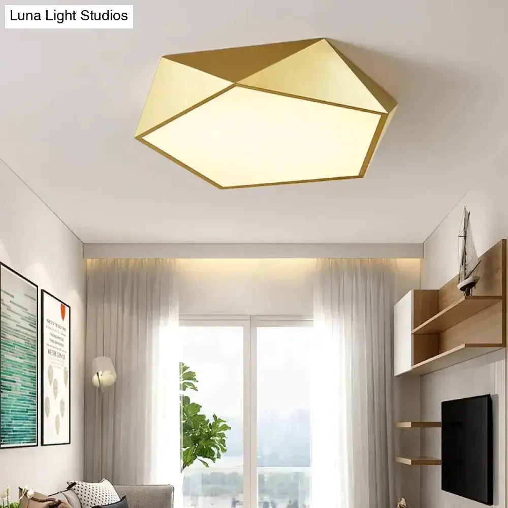 Gold geometric ceiling light with modern faceted design and warm illumination for living room or bedroom lighting