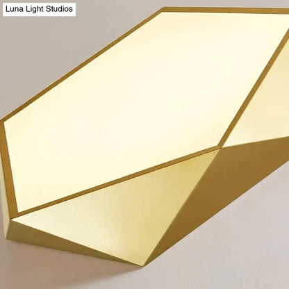 Decorbites modern gold-finished geometric wall sconce with faceted design and soft diffused indoor lighting