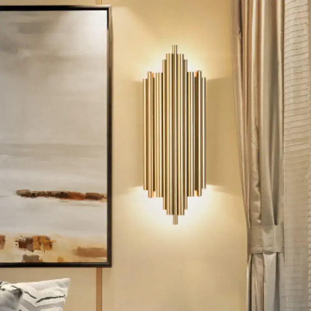 Modern gold finish wall lamp with slim tube vertical rods in a symmetrical radiating pattern for living room use