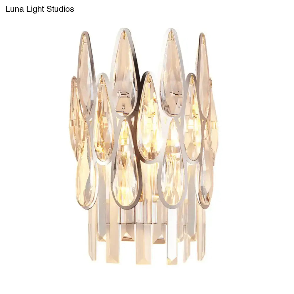 Modern gold finish wall lamp with teardrop crystal elements in polished chrome frames for bedroom sconce lighting