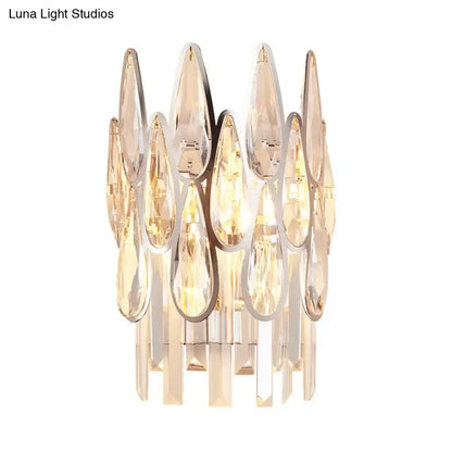 Modern gold finish wall lamp with teardrop crystal elements in polished chrome frames for bedroom sconce lighting