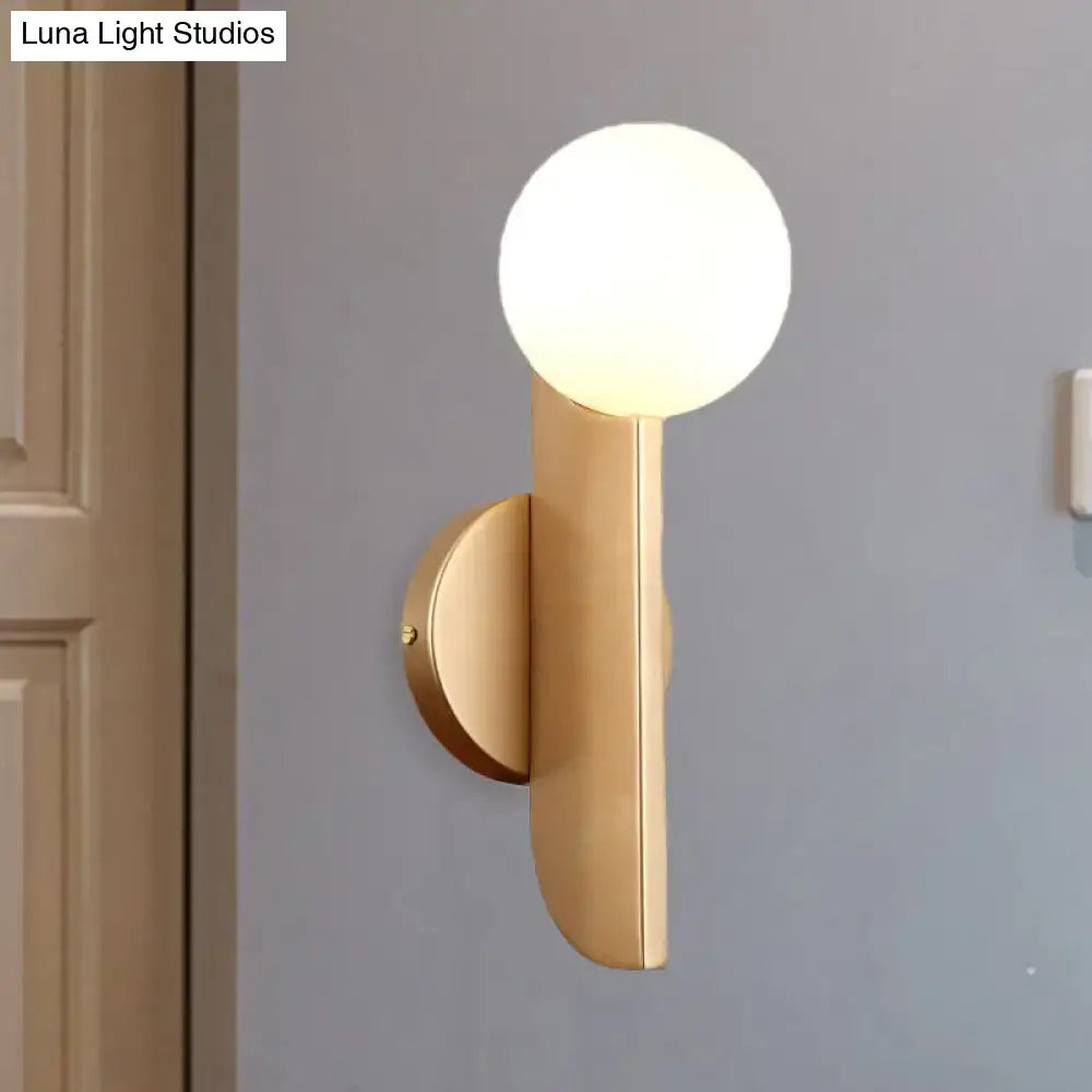 Modern gold finish wall sconce with milky glass shade and frosted globe for elegant bedroom lighting