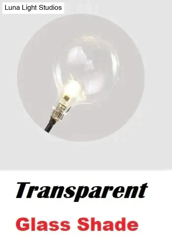 Clear glass globe led wall light with visible filament and metallic base for modern gold firefly tree branch design