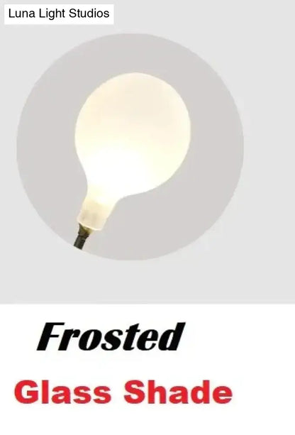 Modern gold firefly tree branch led wall light with frosted glass bulb and soft diffused glow for bedroom use