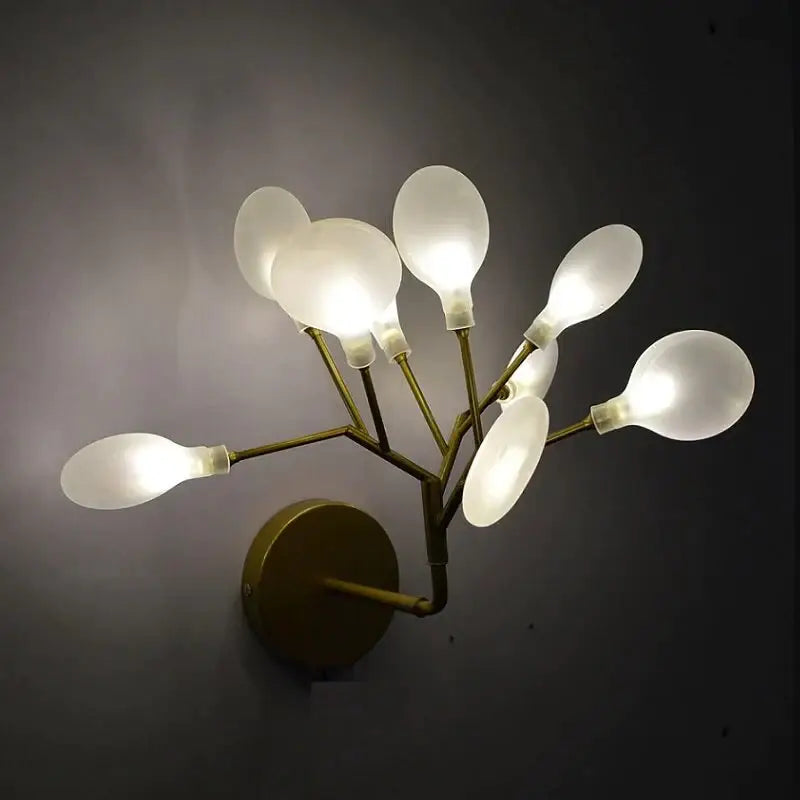 Modern gold firefly tree branch led wall light with six frosted glass shades in a branching design for bedroom use