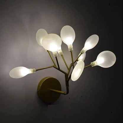 Modern gold firefly tree branch led wall light with six frosted glass shades in a branching design for bedroom use