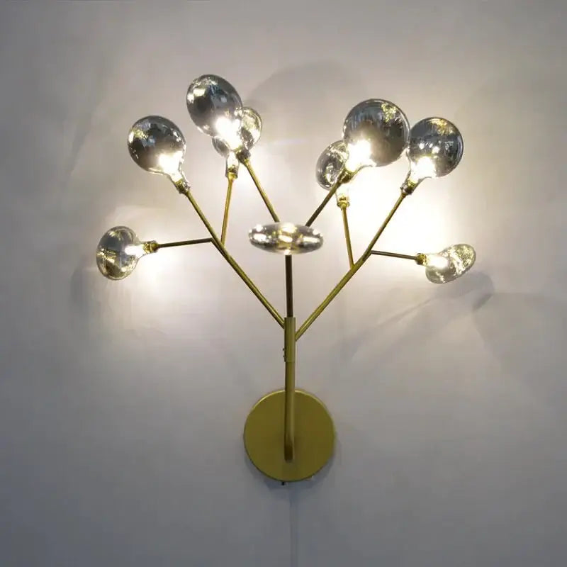 Modern gold firefly tree branch led wall light with spherical glass bulbs as a decorative led wall light for bedroom