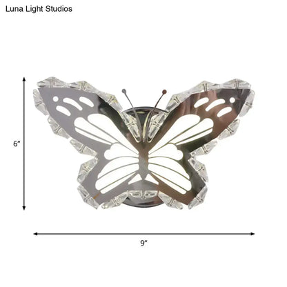 Modern gold fish wall sconce with chrome finished stainless steel butterfly design and crystal shade for warm white bedroom light