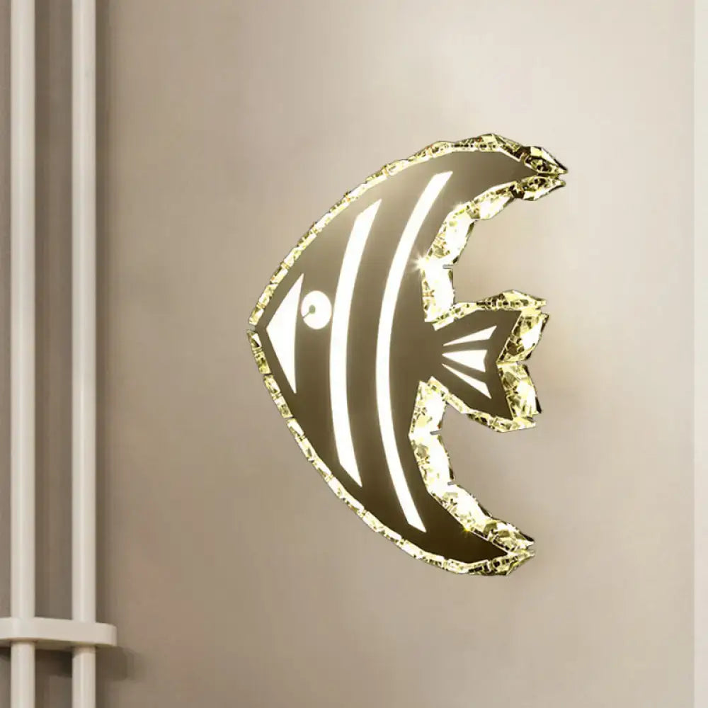 Modern gold fish wall sconce with stainless steel crystal shade and black and white stripes for warm white bedroom lighting