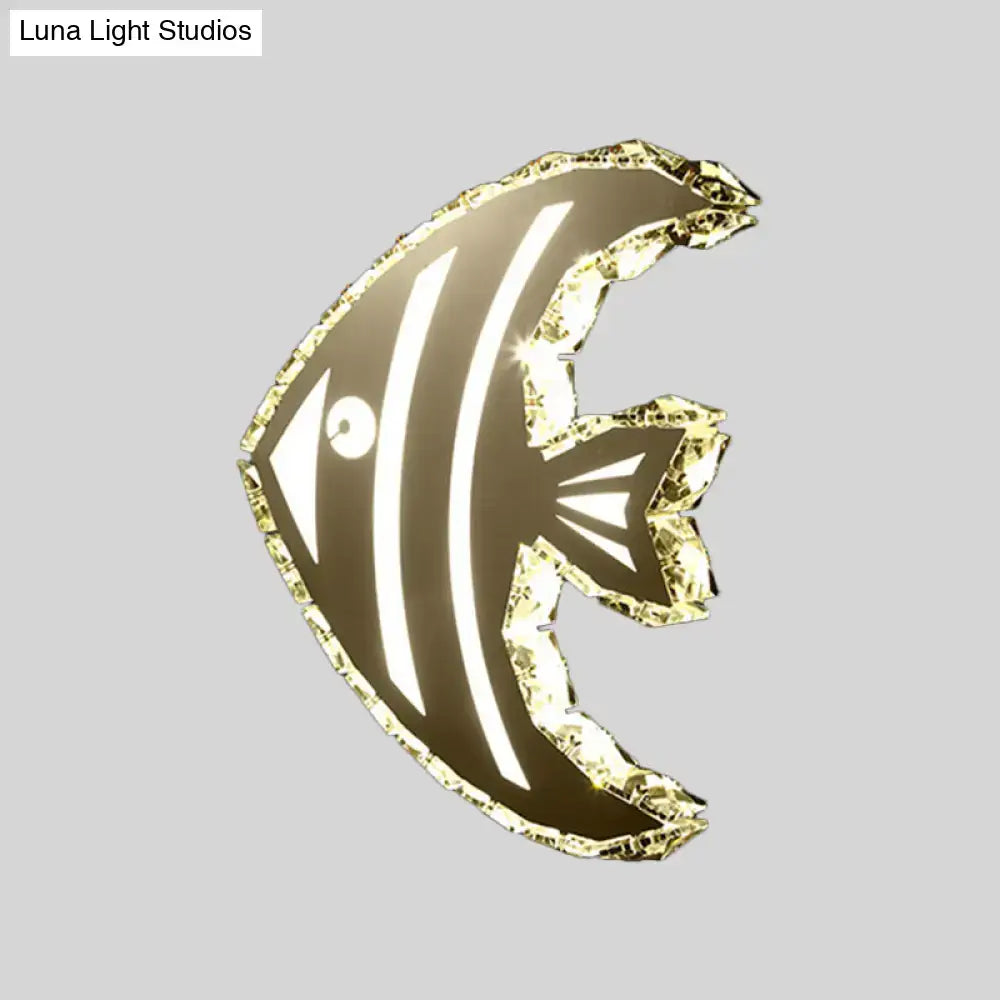 Modern gold fish wall sconce with stainless steel finish crystal shade and warm white light for bedroom use