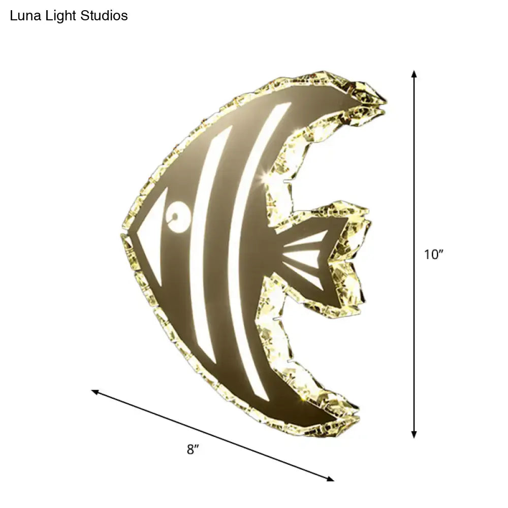 Modern gold fish wall sconce with crystal shade and stainless steel finish featuring warm white light for bedroom use