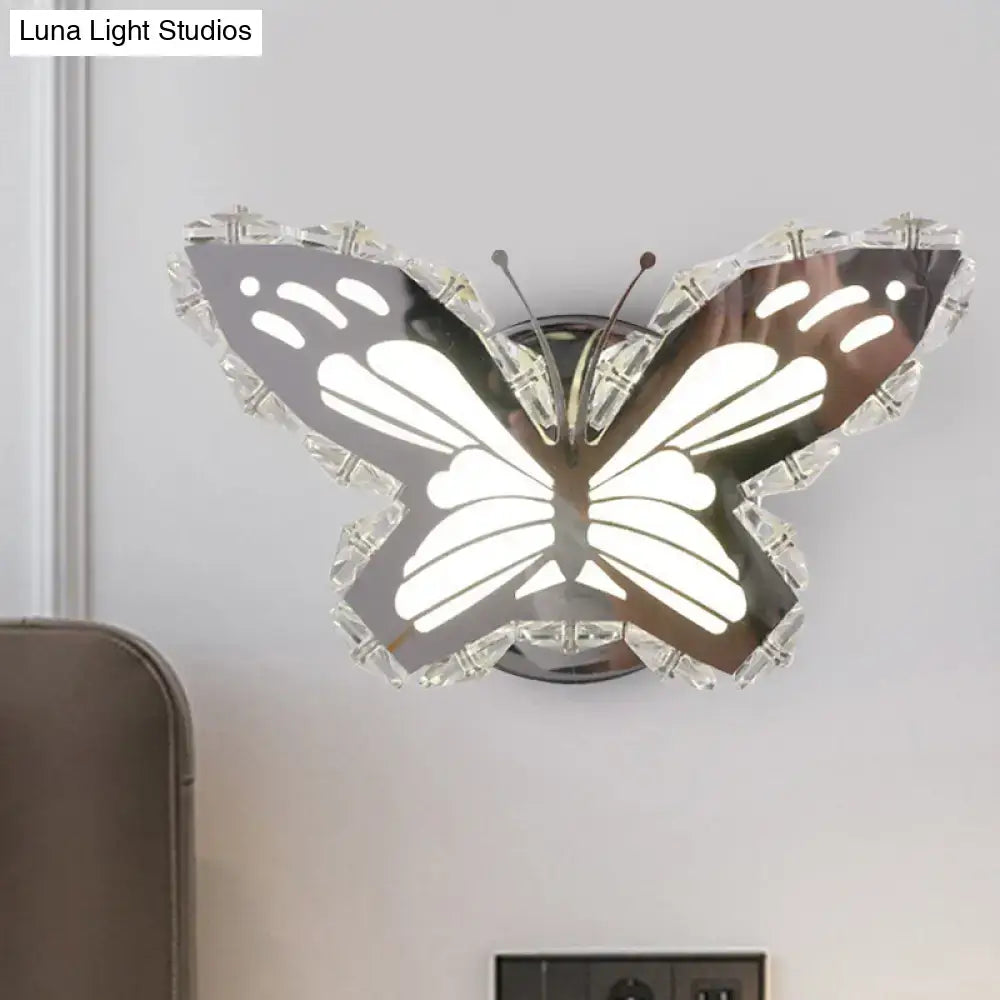 Modern gold fish wall sconce with stainless steel butterfly shape, crystal shade, and warm white bedroom light