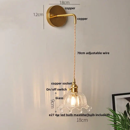 Modern gold fluted clear glass led wall light with brass-finished copper and petal-shaped shade decorbites clear glass wall light
