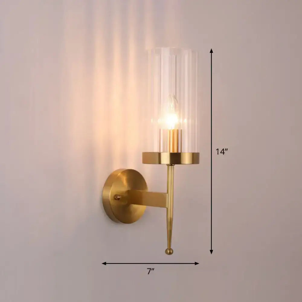A sleek modern gold wall lamp with fluted clear glass shade and illuminated bulb for 110v 120v 220v 240v use