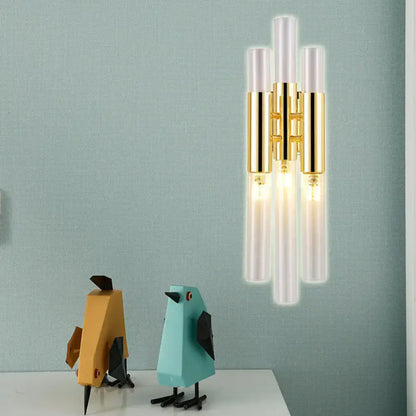Modern gold frosted glass flute wall sconce with five vertical tubes and polished metal accents for living room lighting