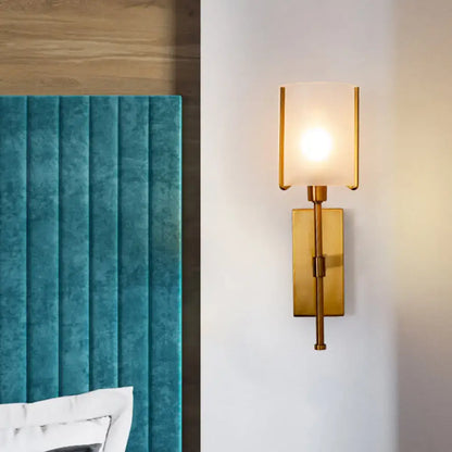Modern gold rectangular wall sconce with frosted glass shade and pencil arm light fixture for bedroom use