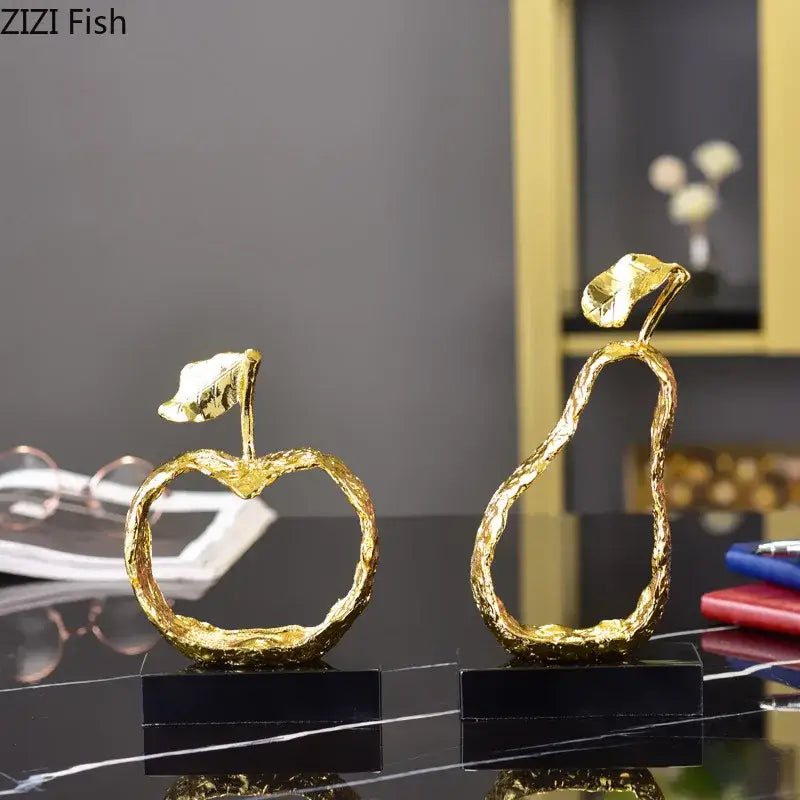 Modern gold fruit shaped metal crafts featuring textured golden apple and pear sculptures for living room decorbites decor