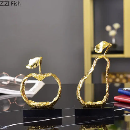 Modern gold fruit shaped metal crafts featuring textured golden apple and pear sculptures for living room decorbites decor