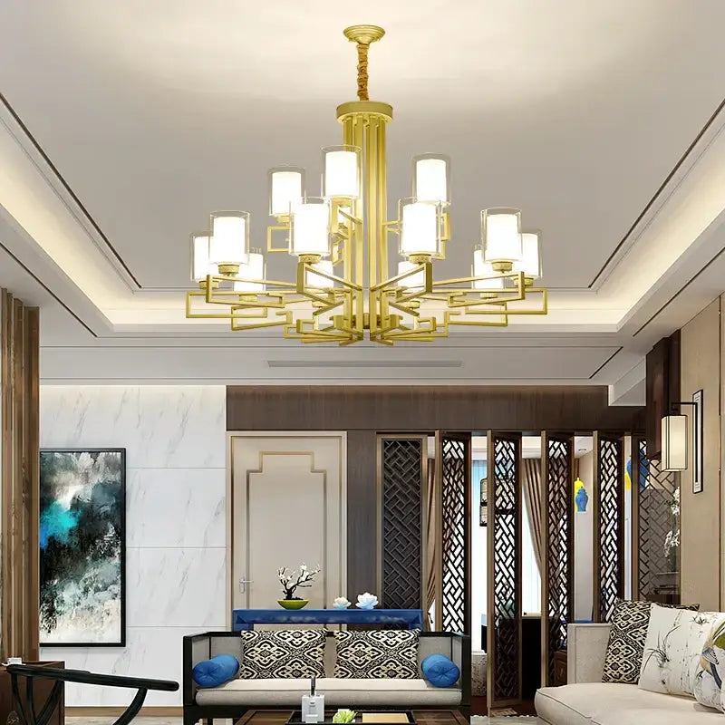 Modern gold geometric chandelier with frosted glass shades designed for luxury living room lighting