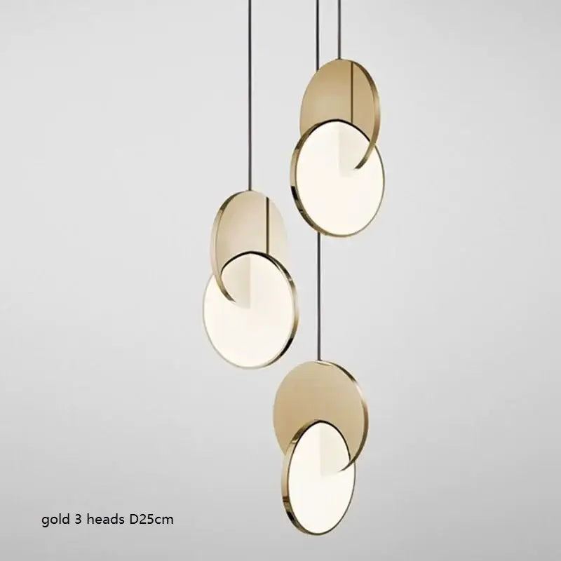 Modern gold geometric circle pendant light with three overlapping discs featuring metallic rims and frosted glass centers