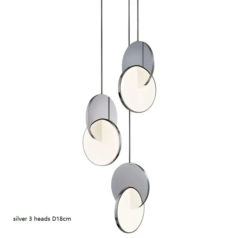 Modern silver pendant light with three frosted glass heads and metallic frame matching decorbites geometric circle design