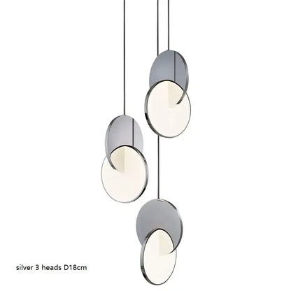 Modern silver pendant light with three frosted glass heads and metallic frame matching decorbites geometric circle design