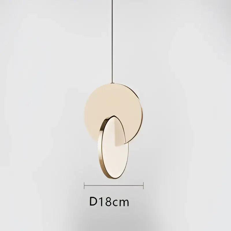 Modern gold geometric circle pendant light with two overlapping discs in matte beige and polished gold metal for dining room decorbites geometric circle