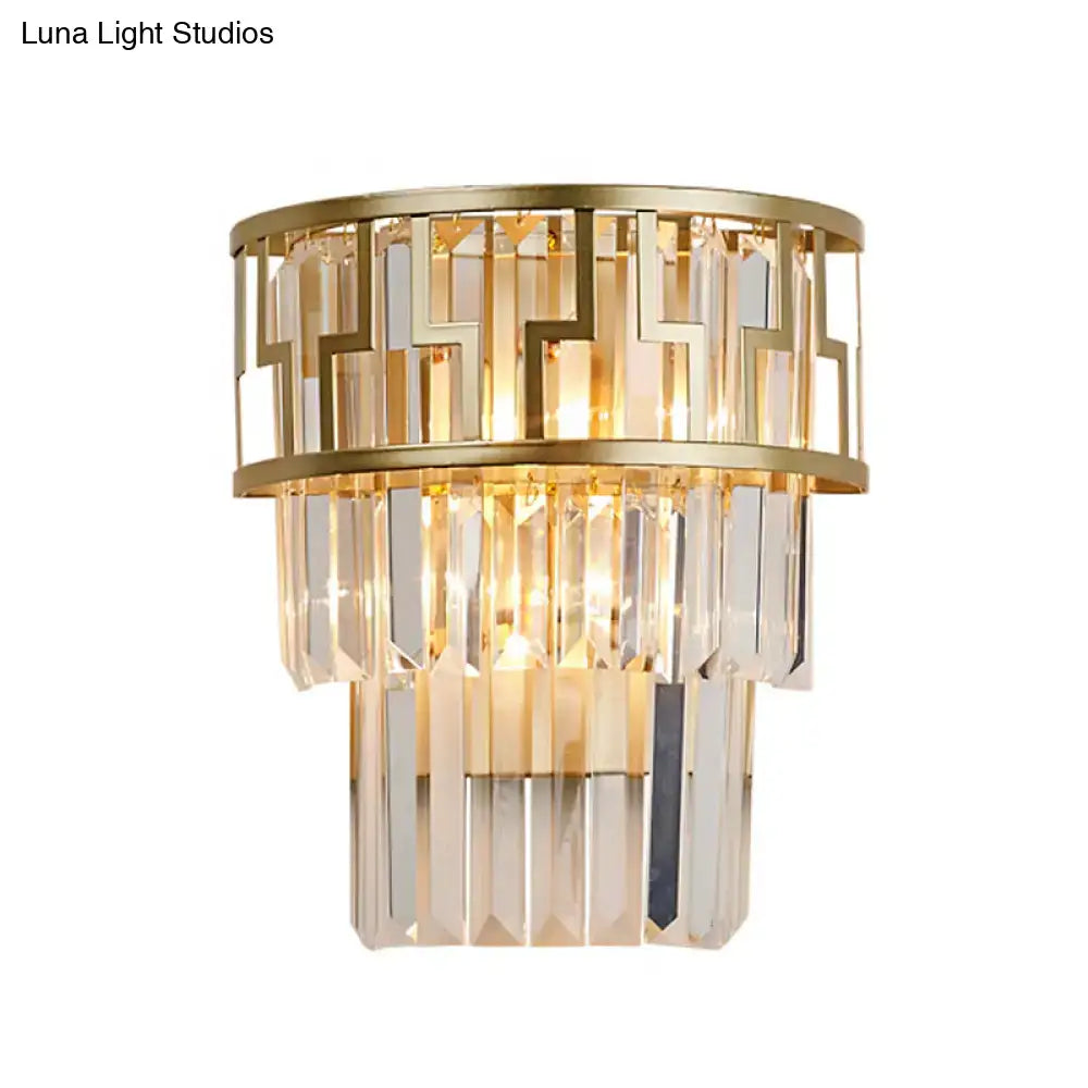 Modern gold geometric wall lamp with clear crystal tiered accents and metal framing sconce fixture for bedroom use