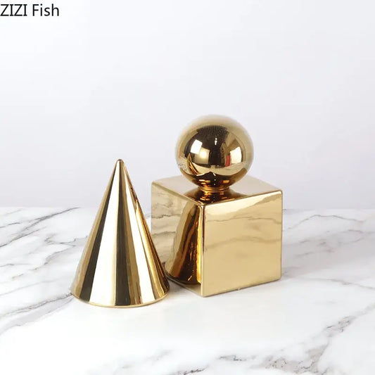 Modern gold metallic geometric cube round statue decor featuring cone and cube shapes for living room display