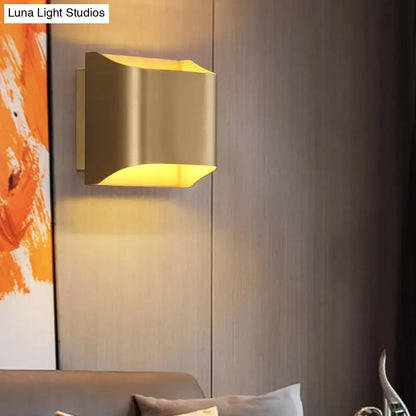Modern gold geometric LED wall sconce with sleek angular design and warm light featuring a G9 bulb base