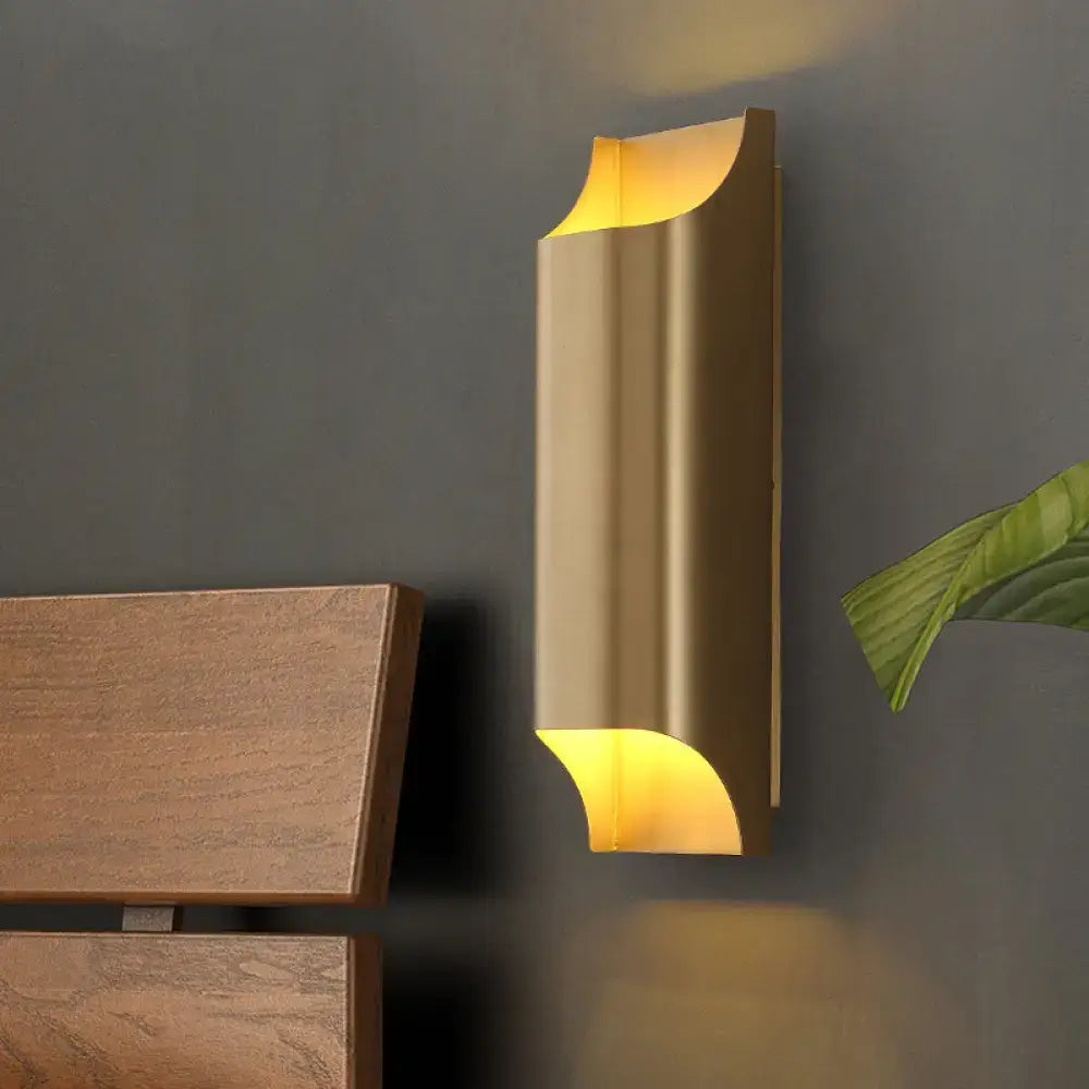 Modern gold geometric led wall sconce with sleek curved design and g9 bulb base providing warm ambient lighting