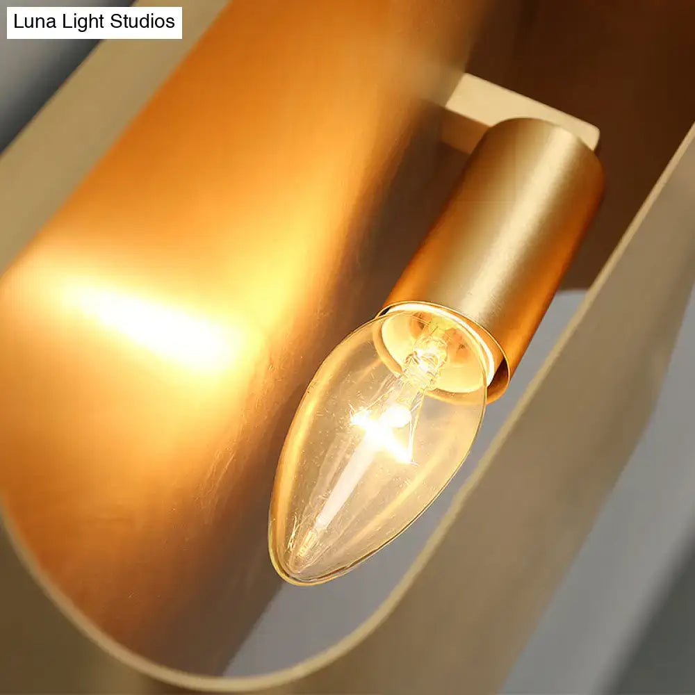 Modern gold geometric led wall sconce with warm-toned brass finish and clear glass candle bulb using g9 bulb base